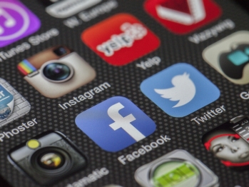 Close up shot of a phone screen with many apps