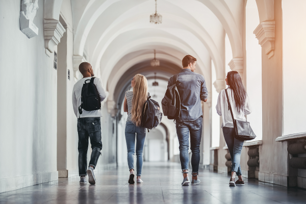 Group of people walking down a hallway